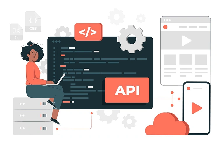 Developer working with API code on a large dark screen connected to cloud services and mobile devices
