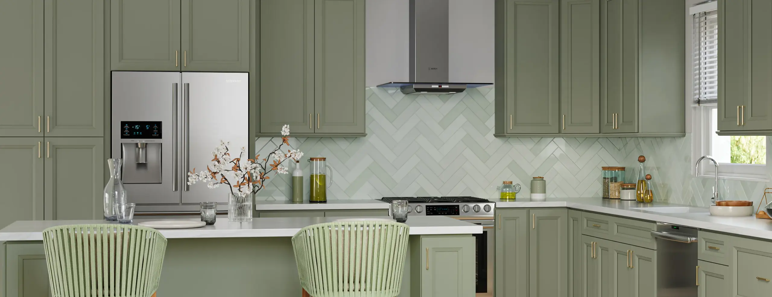 Green kitchen cabinets in a modern kitchen interior